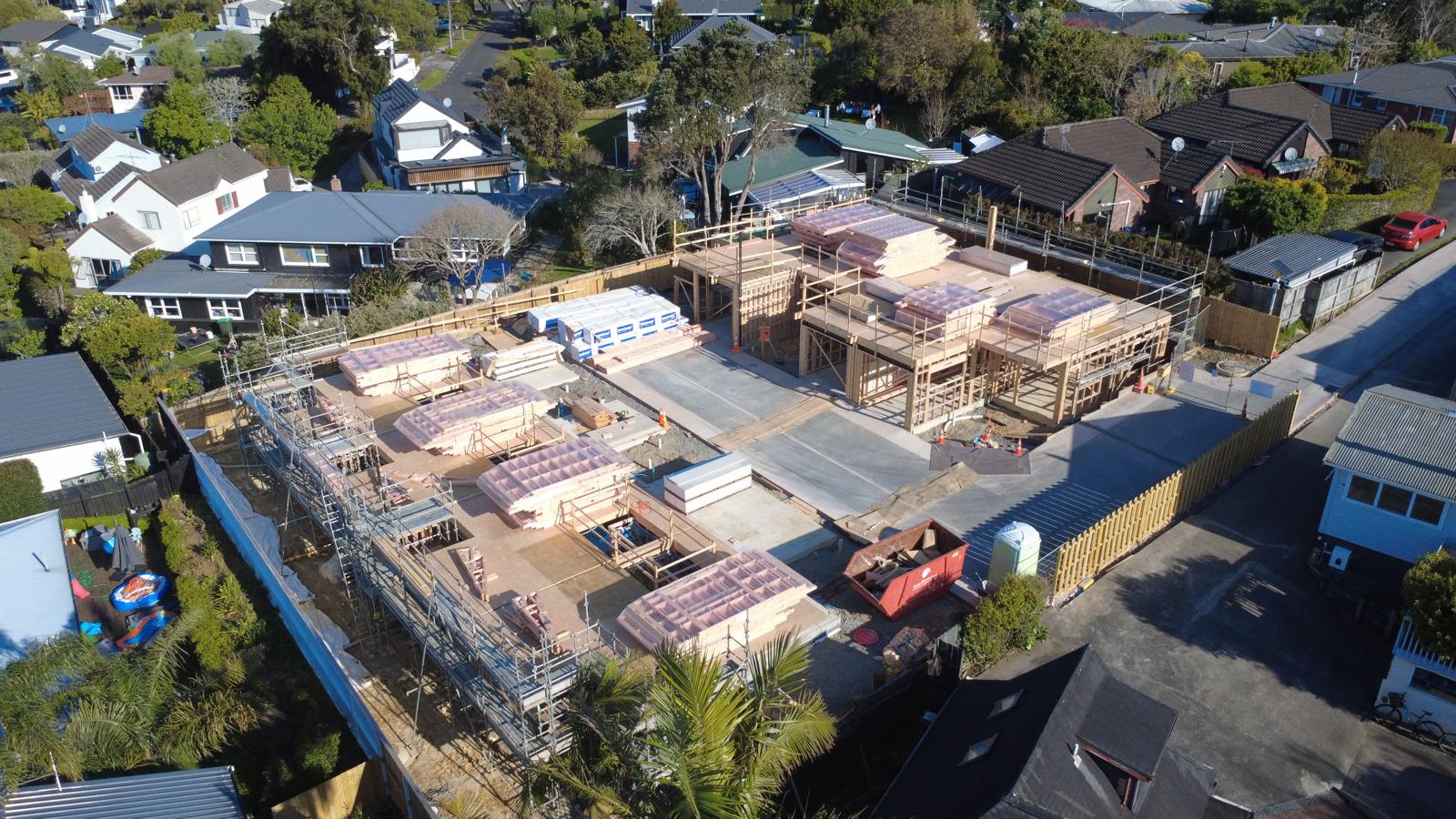 Site overview showing the delivered frames and shared driveway · October 2026