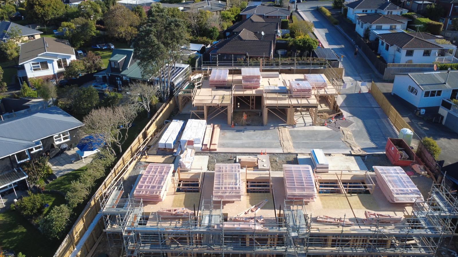 Aerial view across Forty West and the upper-floor frame deliveries · October 2026